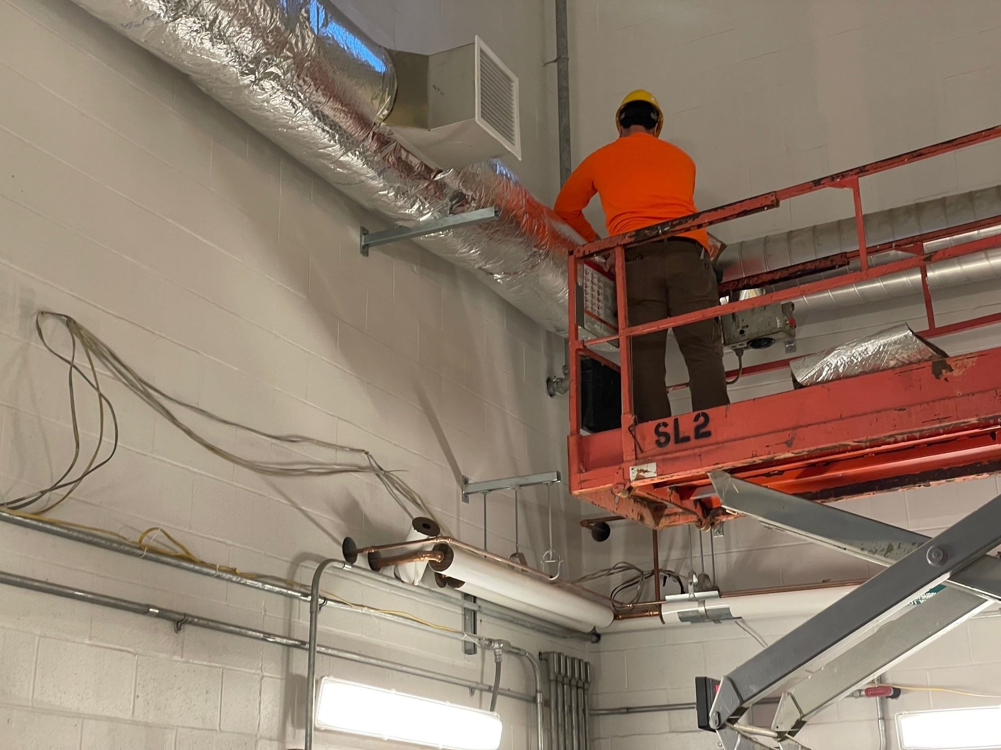 Installation of Insulation on Ductwork in Filter Room